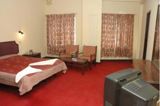 Hotel Preethi Palace Ooty Szoba fotó